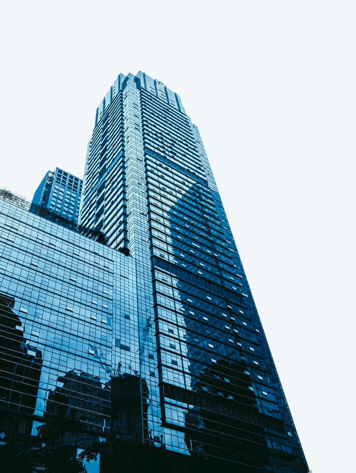Glass skyscraper photographed from street level